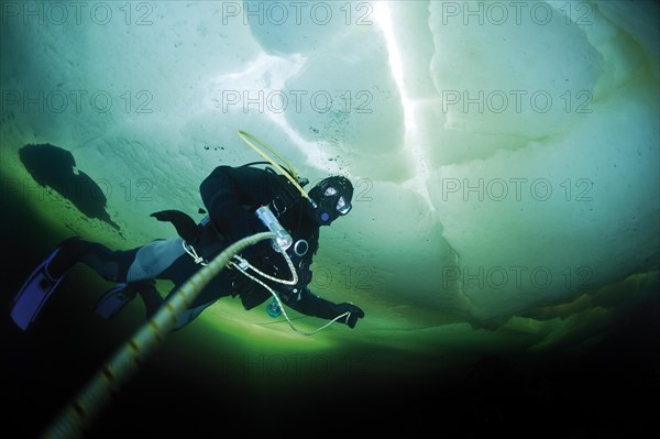 Diver under ice