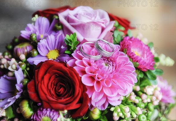 Wedding rings on wedding bouquet