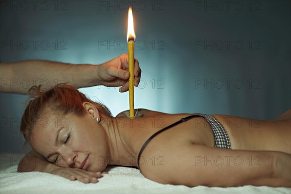 Woman being treated with a body candle