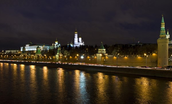 Moscow Kremlin with palace and cathedrals on Moskva River at night