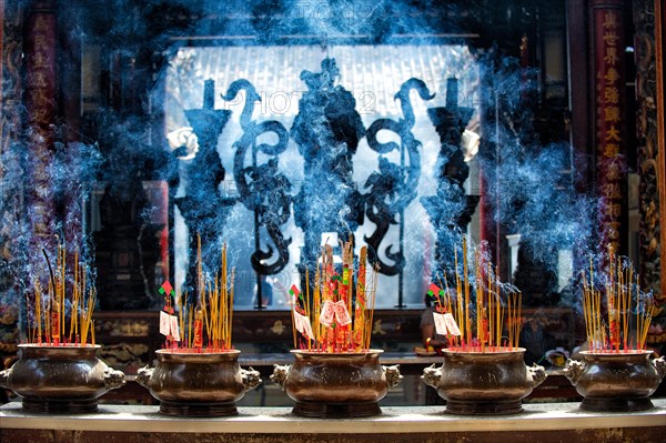 Incense sticks and incense coils in a temple