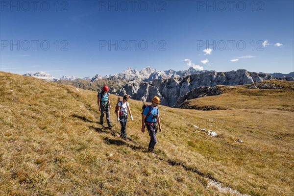 Hikers during the ascent to Cima Valacia on the Via Ferrata F. Gadotti in the Val San Nicolo di Fassa