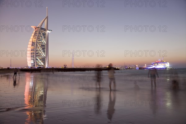 Luxury hotel Burj Al Arab and Jumeirah Beach at the blue hour