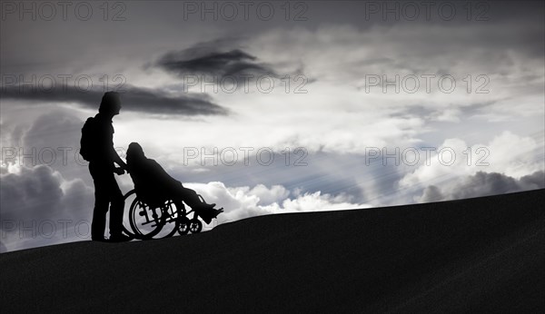 Person pushing a wheelchair