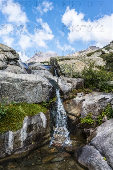 Pool with a small waterfall in the mountains