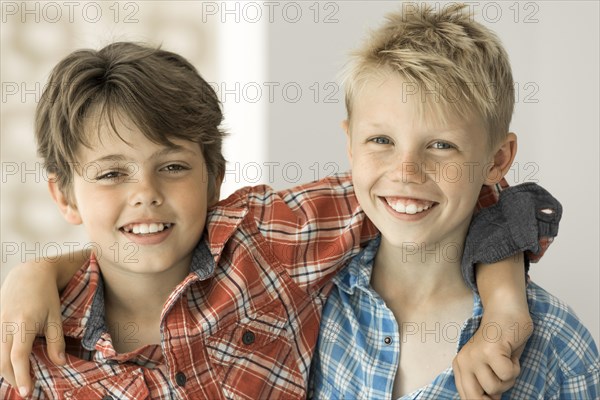 Two boys in plaid shirts