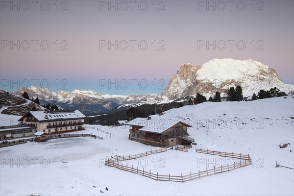 Sunset over Plattkofel and Mahlknechthutte hut in winter