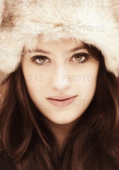 Young woman wearing a fur hat