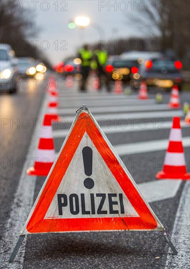 Police warning triangle during a spot check on traffic