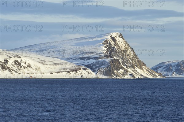 Norwegian Sea and island coast with buildings