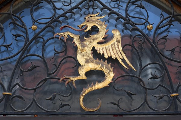 Dragon figure over the entrance of the town hall
