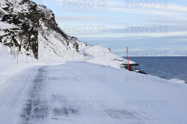 The snow-covered main road E69 on Porsangerfjord