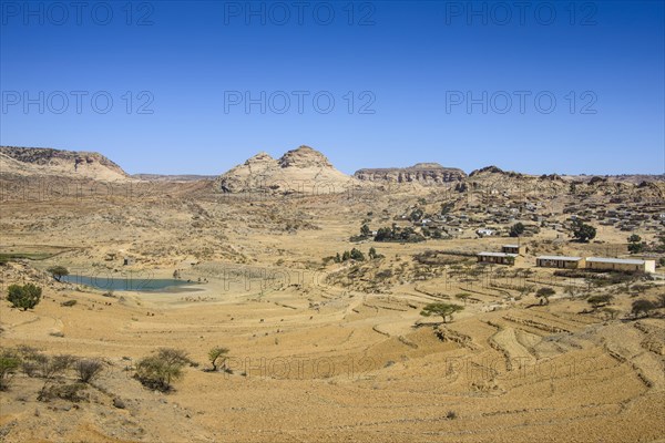 Mountain landscape along the road from Asmarra to Qohaito with a little pond