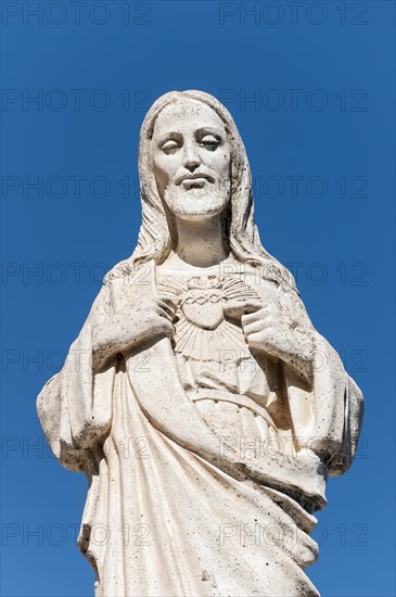 White statue of Jesus Christ outside the Chapel of Virgen de la Pena