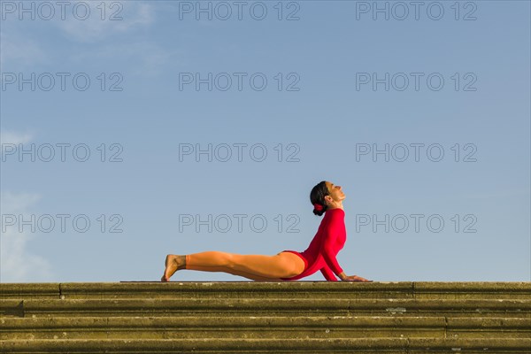 Young woman practising Hatha yoga