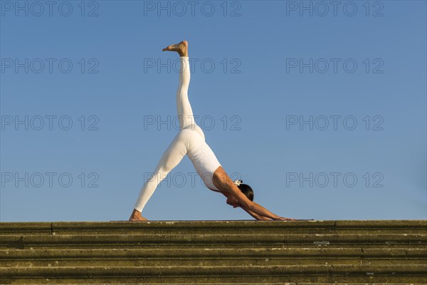 Young woman practising Hatha yoga