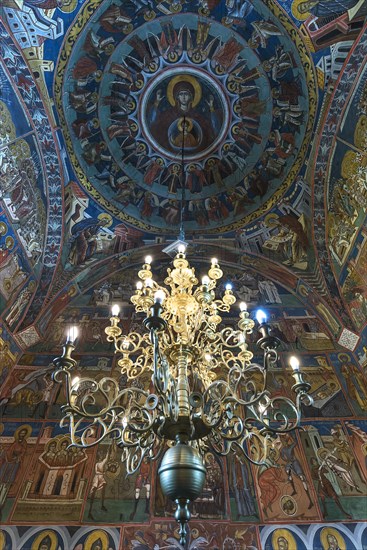 Candlestick under painted vaulted ceiling