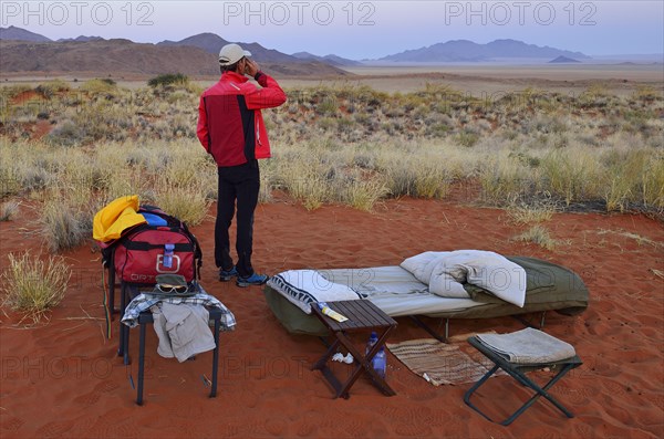 Tourist standing in an open air campsite at Schafberg Camp on Tok Tokkie Trail