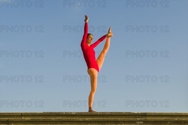 Young woman practising Hatha yoga