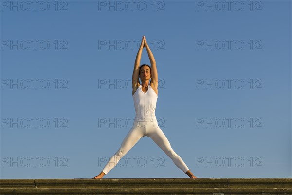 Young woman practising Hatha yoga