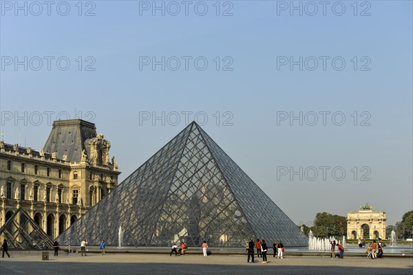 Glass pyramid in the courtyard of the Palais du Louvre and Arc de Triomphe du Carrousel