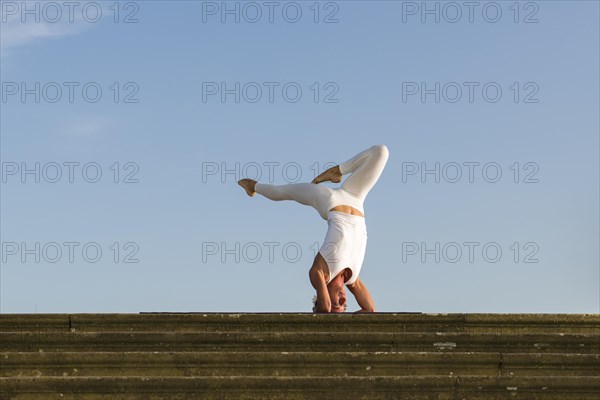 Young woman practising Hatha yoga