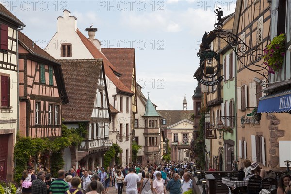 Half-timbered houses and tourists in the Rue du General du Gaulle