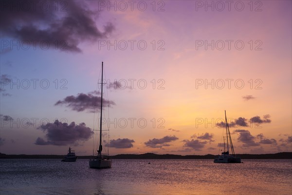 Sunset and sailboats in the Nonsuch Bay