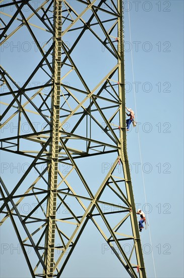 Workers on a pylon