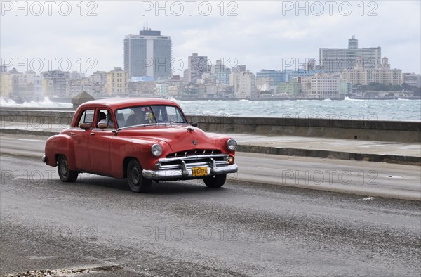 American vintage car travelling on the Malecon