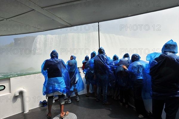 Tourists in raincoats on the tour boat Maid of the Mist