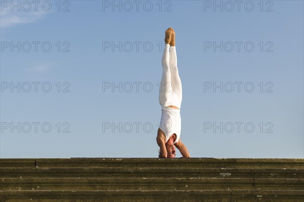 Young woman practising Hatha yoga