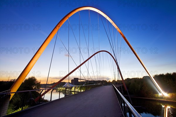 Illuminated double arch bridge over the Rhine-Herne Canal