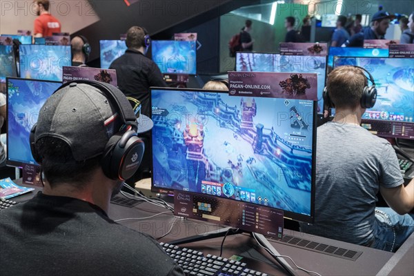 Visitors play video games at Gamescom