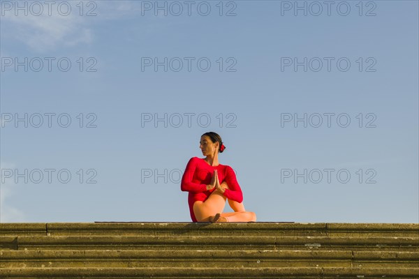 Young woman practising Hatha yoga