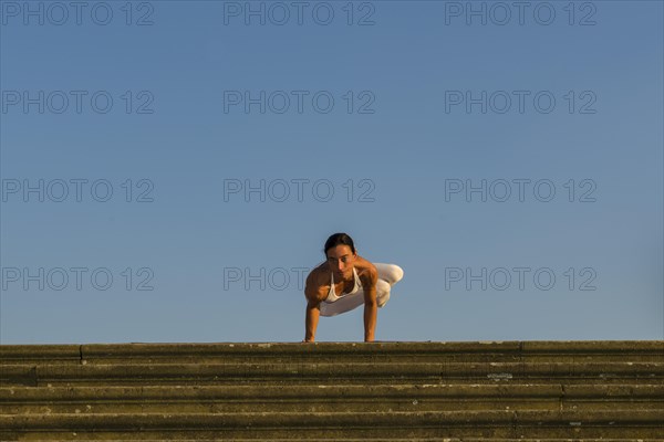 Young woman practising Hatha yoga