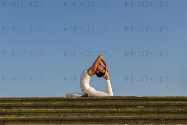 Young woman practising Hatha yoga