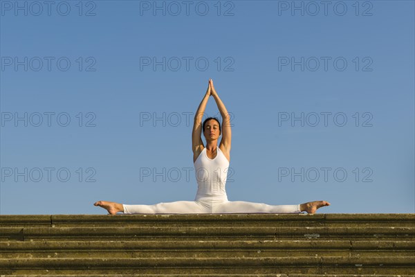 Young woman practising Hatha yoga