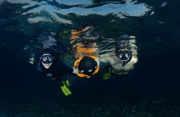 Freediver with an underwater scooter