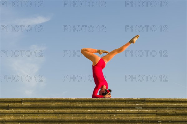 Young woman practising Hatha yoga