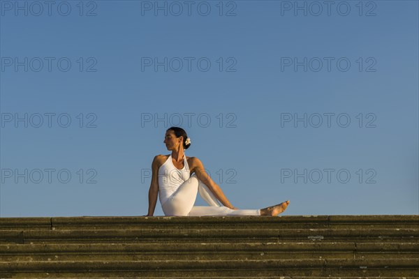 Young woman practising Hatha yoga