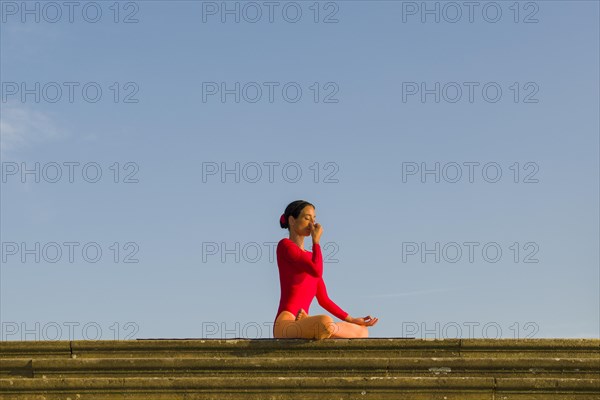 Young woman practising Hatha yoga