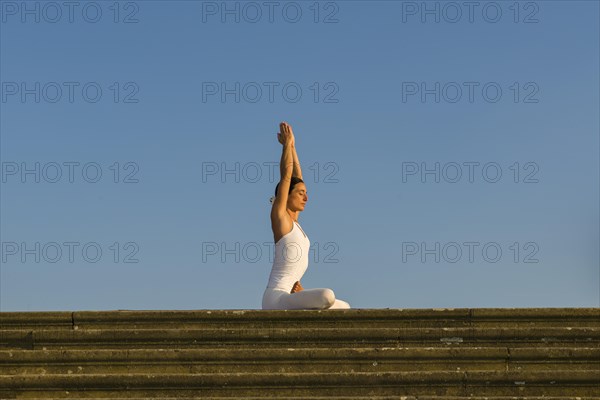 Young woman practising Hatha yoga