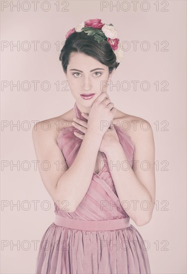 Beauty portrait of a young woman with flowers in her hair