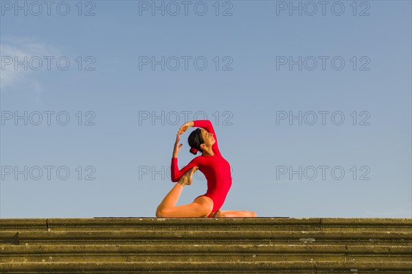 Young woman practising Hatha yoga