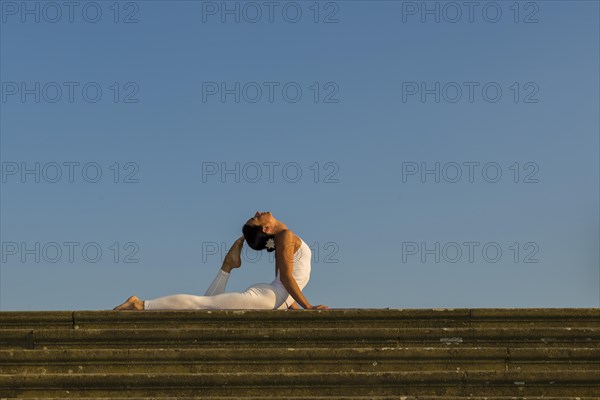 Young woman practising Hatha yoga