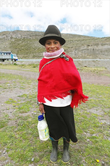 Girl in traditional costume with milk jug