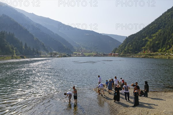 Tourists on the shore of lake Uzungol