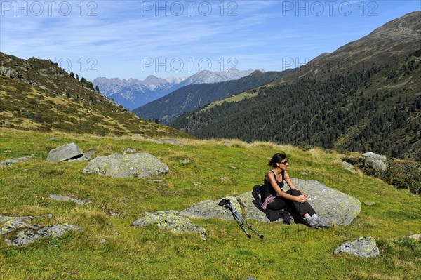 Woman resting after a mountain hike