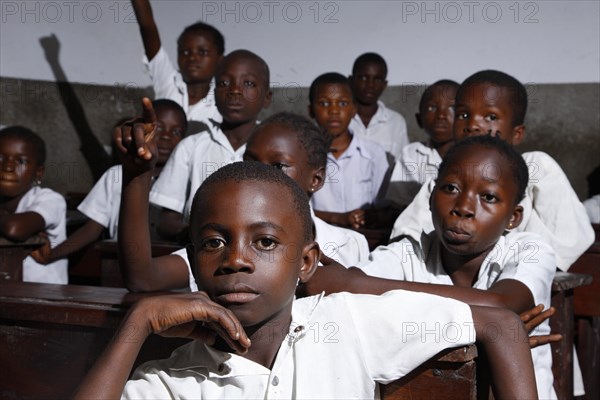 School children in school uniform during class